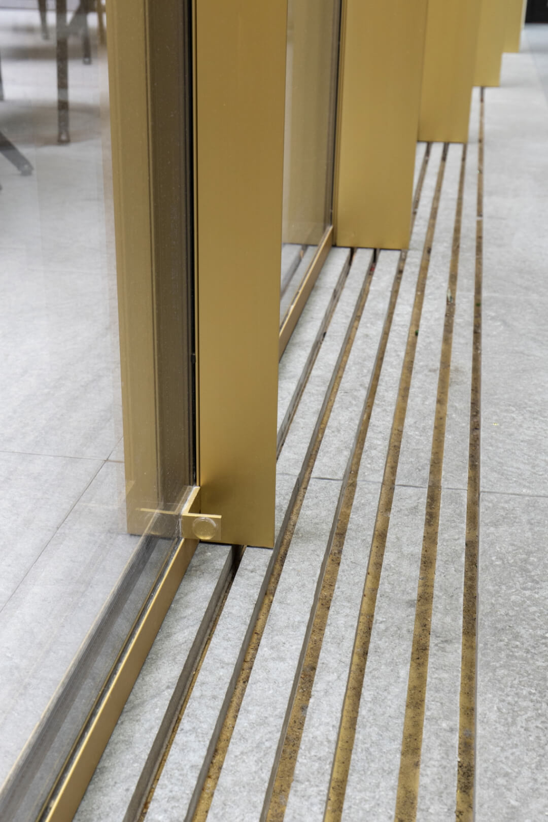 The thermally insulated sliding window used Vitrocsa's patented invisible frame technology.