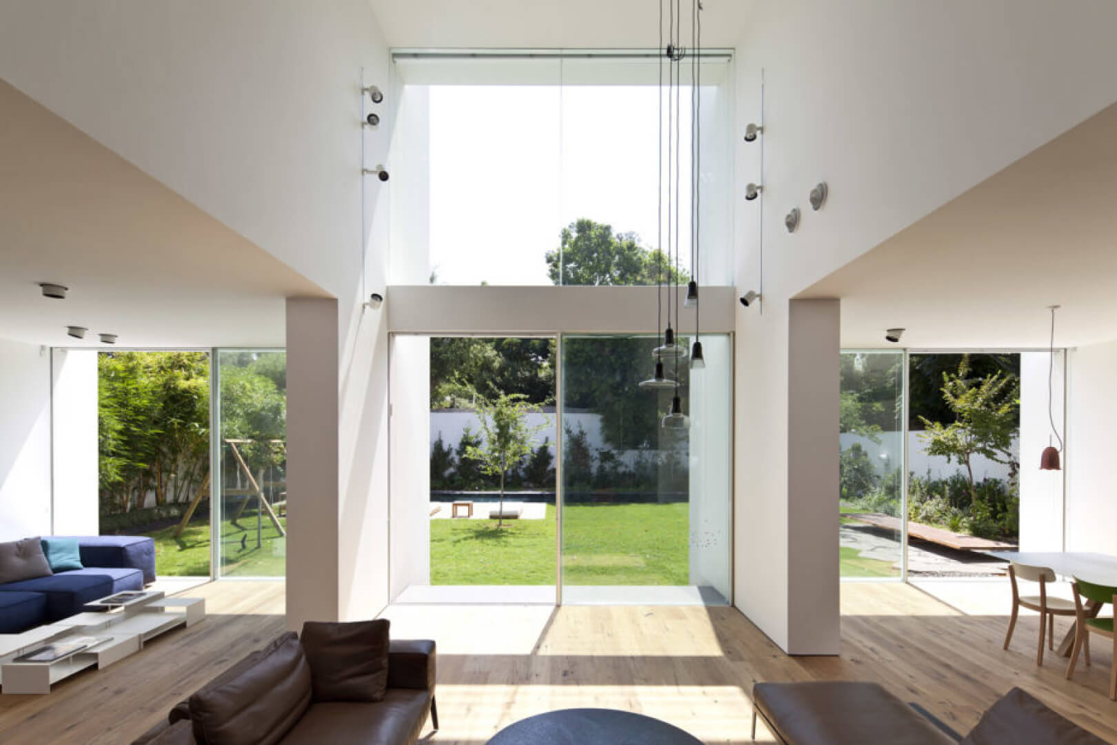 The large Vitrocsa windows at the end of these “tubes” open directly onto the garden.