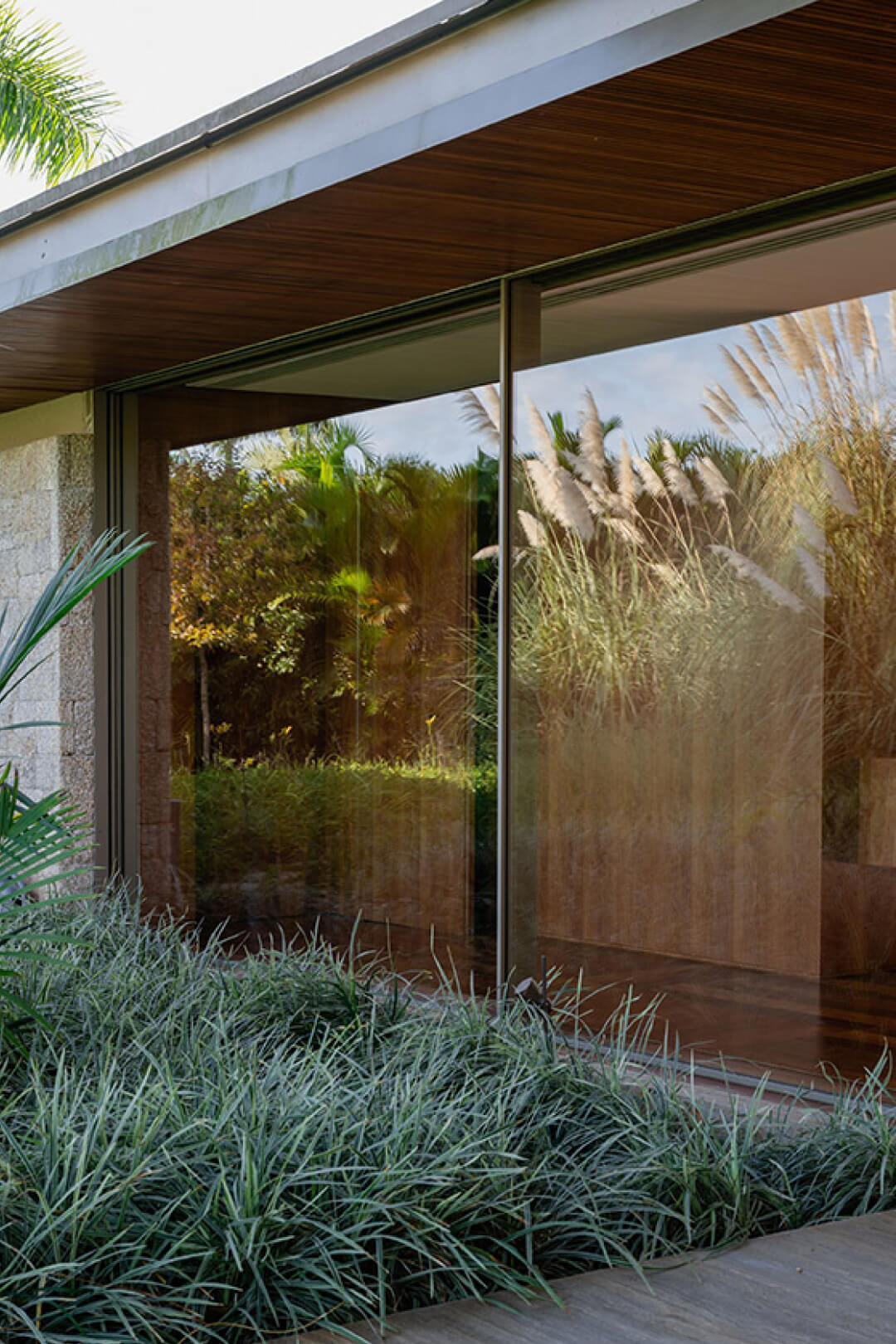 Green Golf Development in São Paulo by Architects Bernardes Arquitetura using Vitrocsa Invisible Frame Sliding Windows.